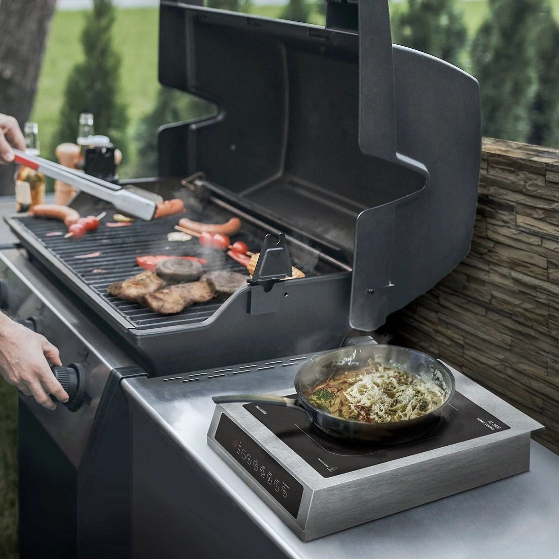 Grill with food and cooktop. Outdoor cooking. Summer meal preparation.