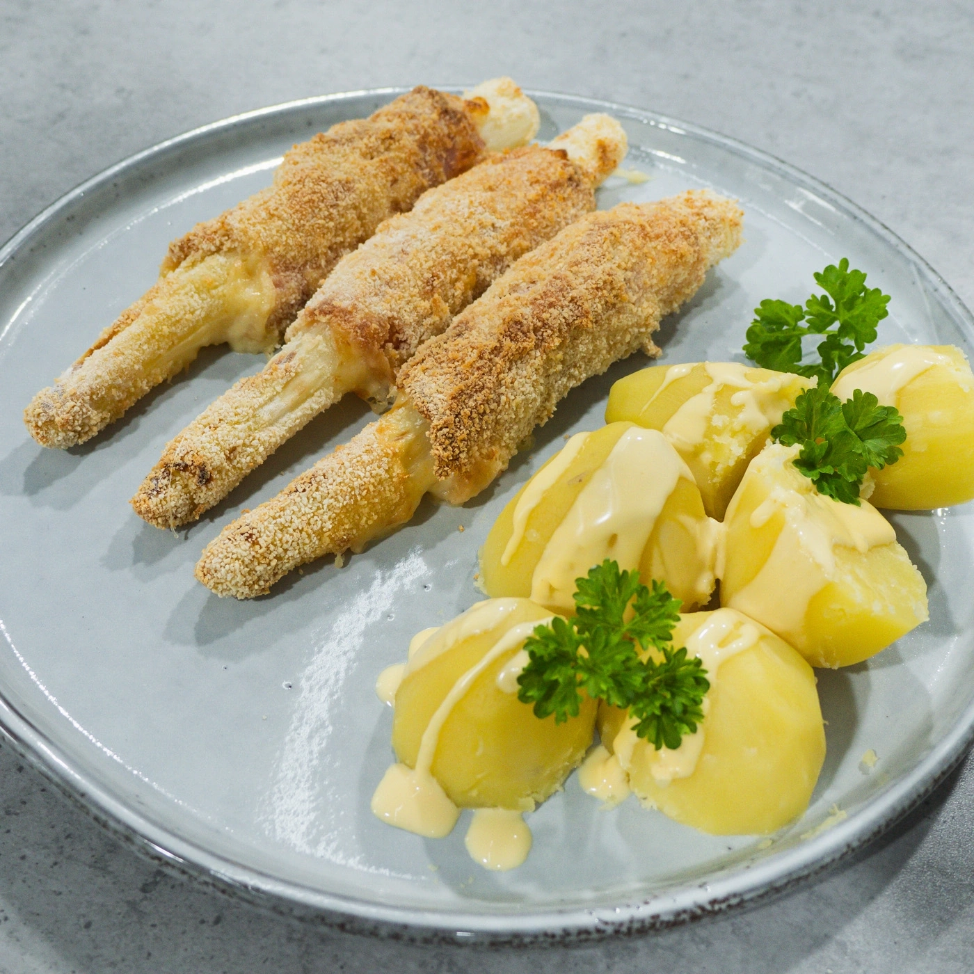 Fried food with potatoes and sauce on a plate, delicious meal