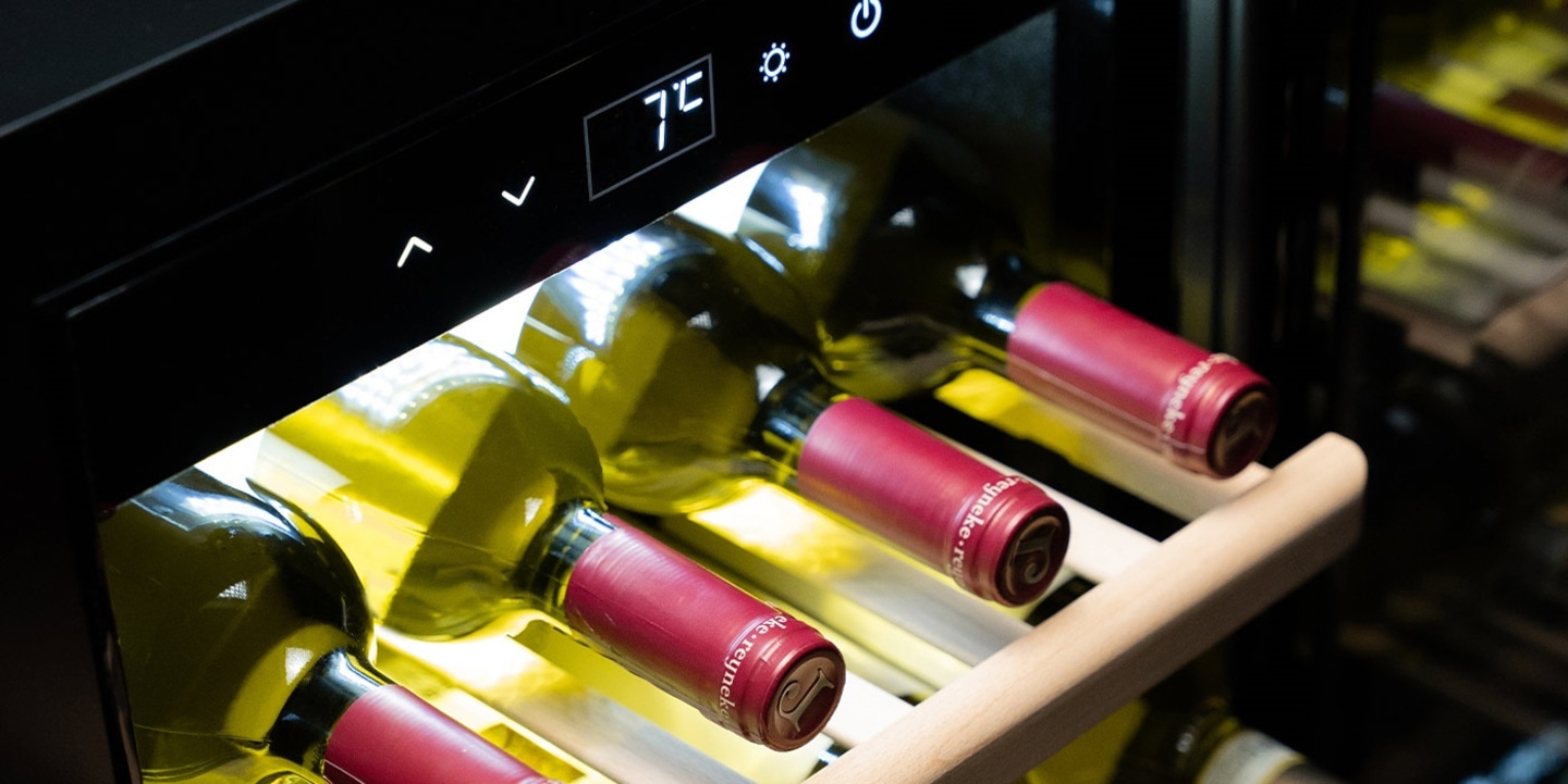 Wine cooler with wine bottles and temperature display