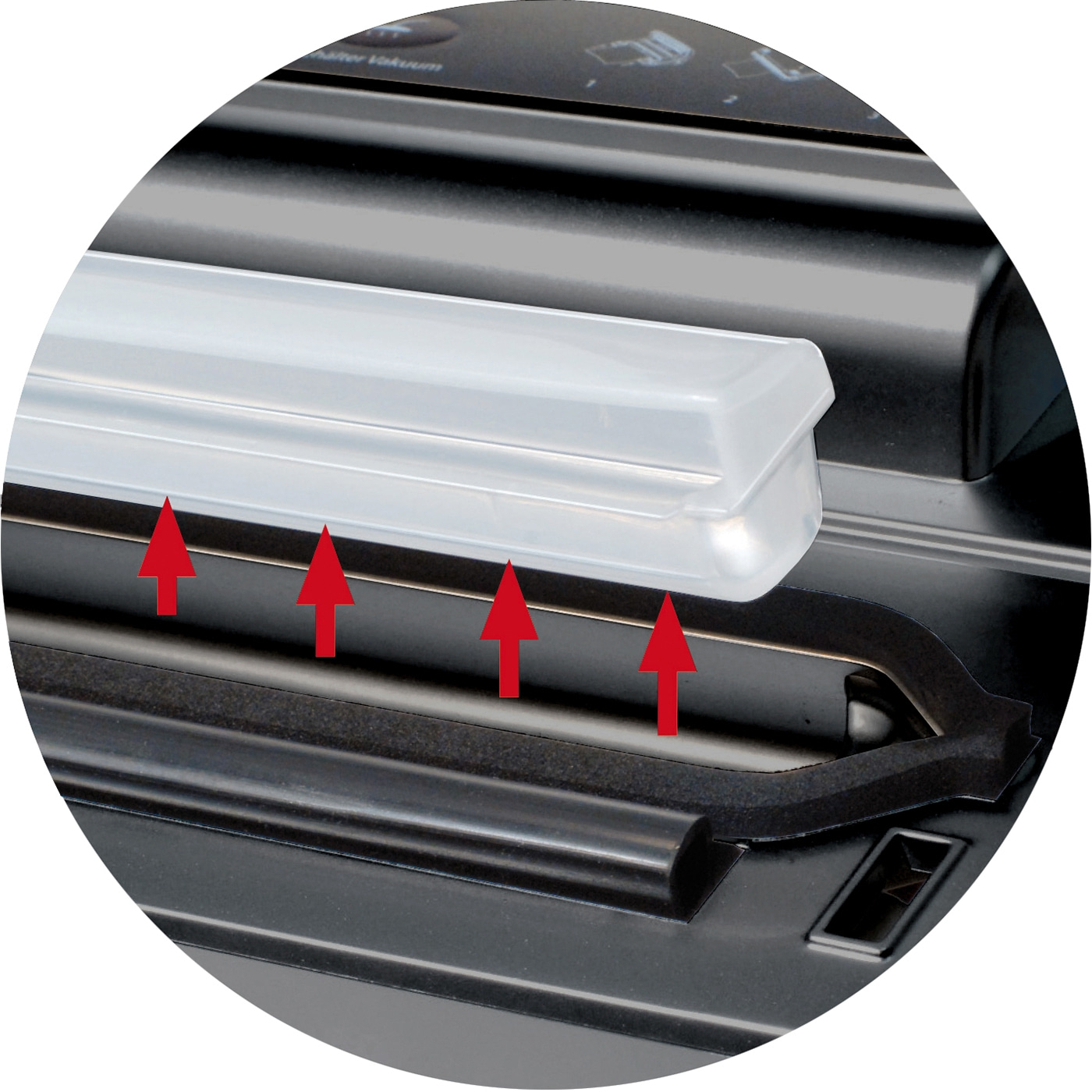 Close-up of a vacuum sealer with arrows pointing to the seal and plastic cover.