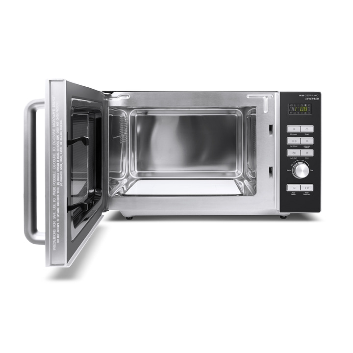 Microwave with open door, control panel, and safety warnings for safe operation.