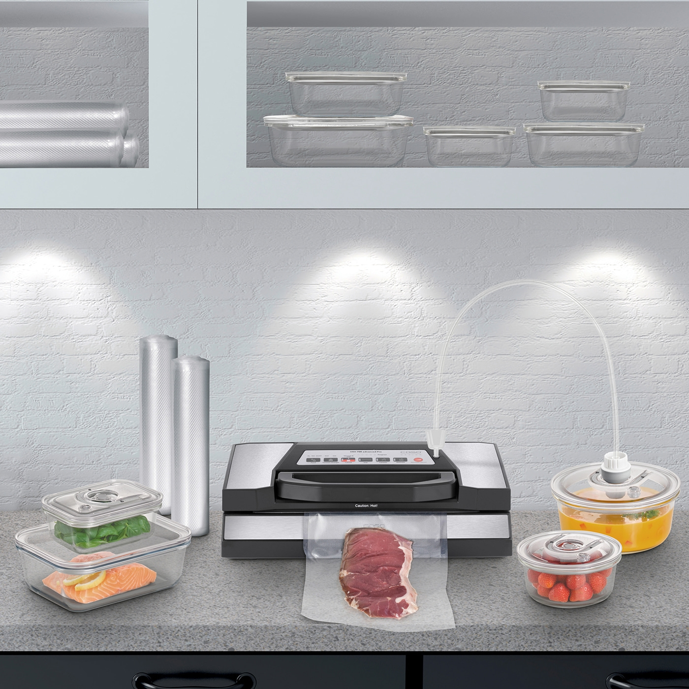 Vacuum sealer with food and containers on a kitchen countertop