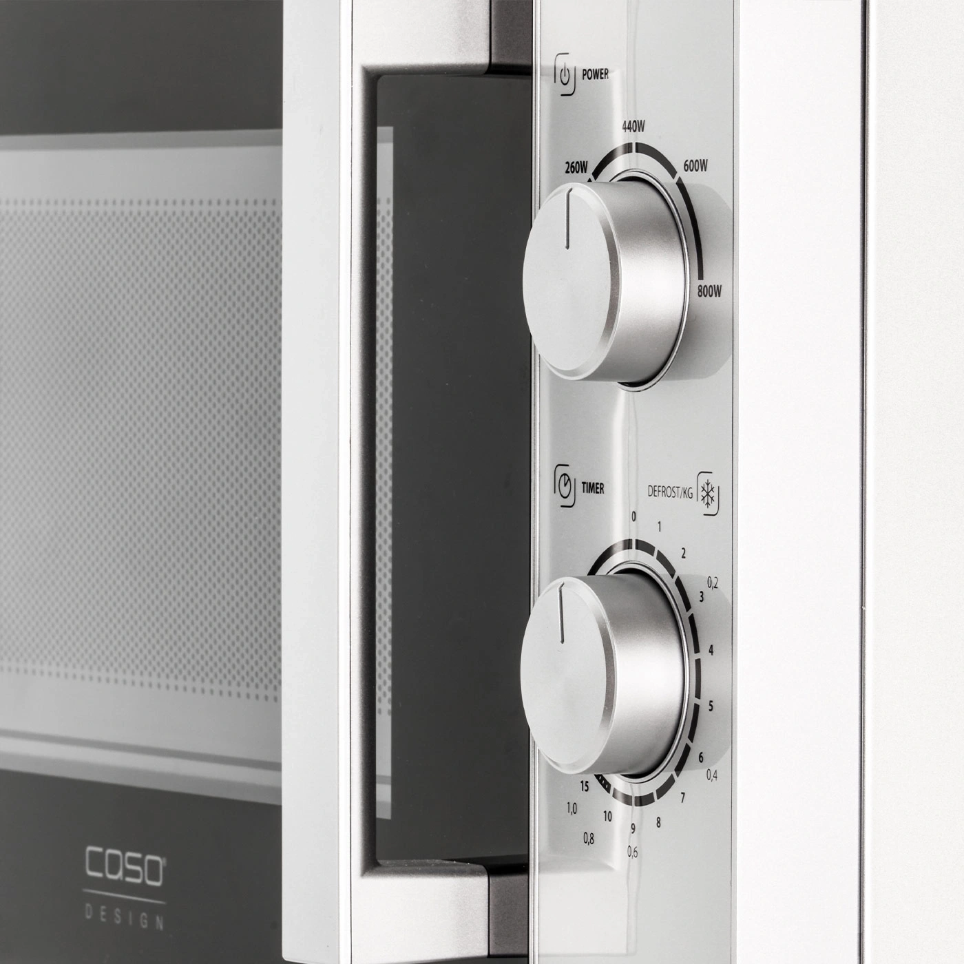 Microwave with power and timer dials, COSO design, silver and black.