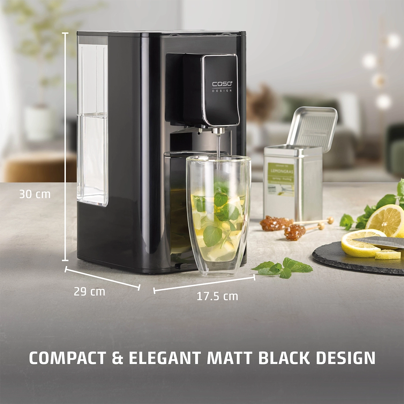 Black tea machine with glass, lemon and mint. Compact and elegant design.