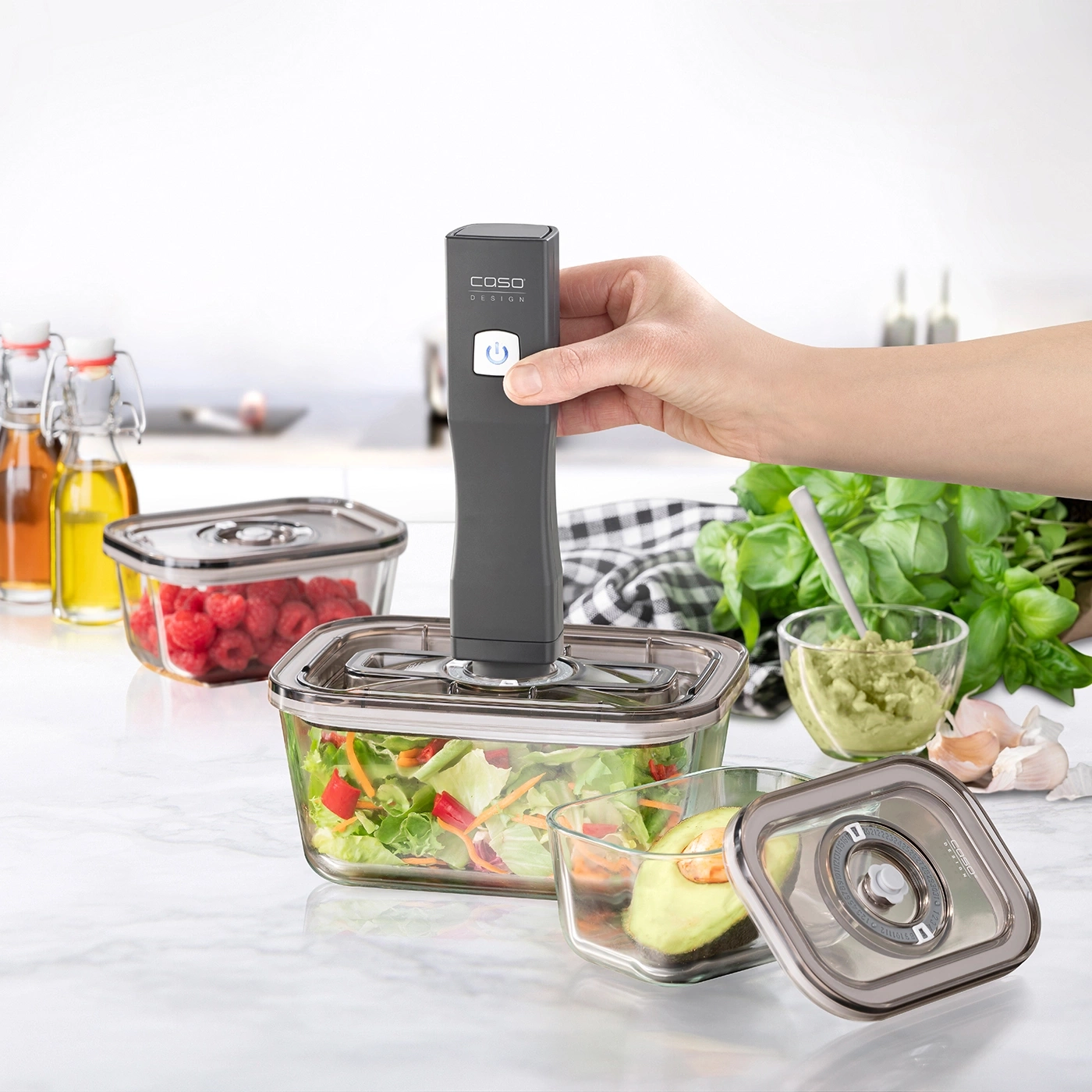 Vacuum sealer with containers, avocado, salad, raspberries, kitchen, food