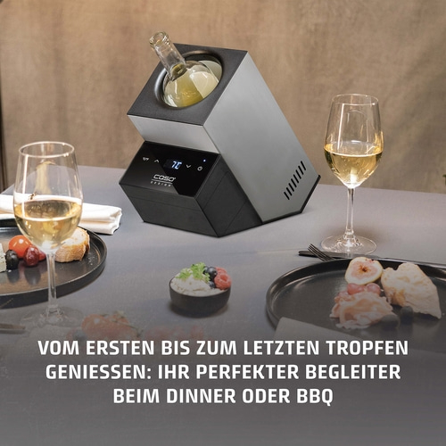 Wine cooler with wine, glasses, and food on a table. Perfect for dinner or BBQ.