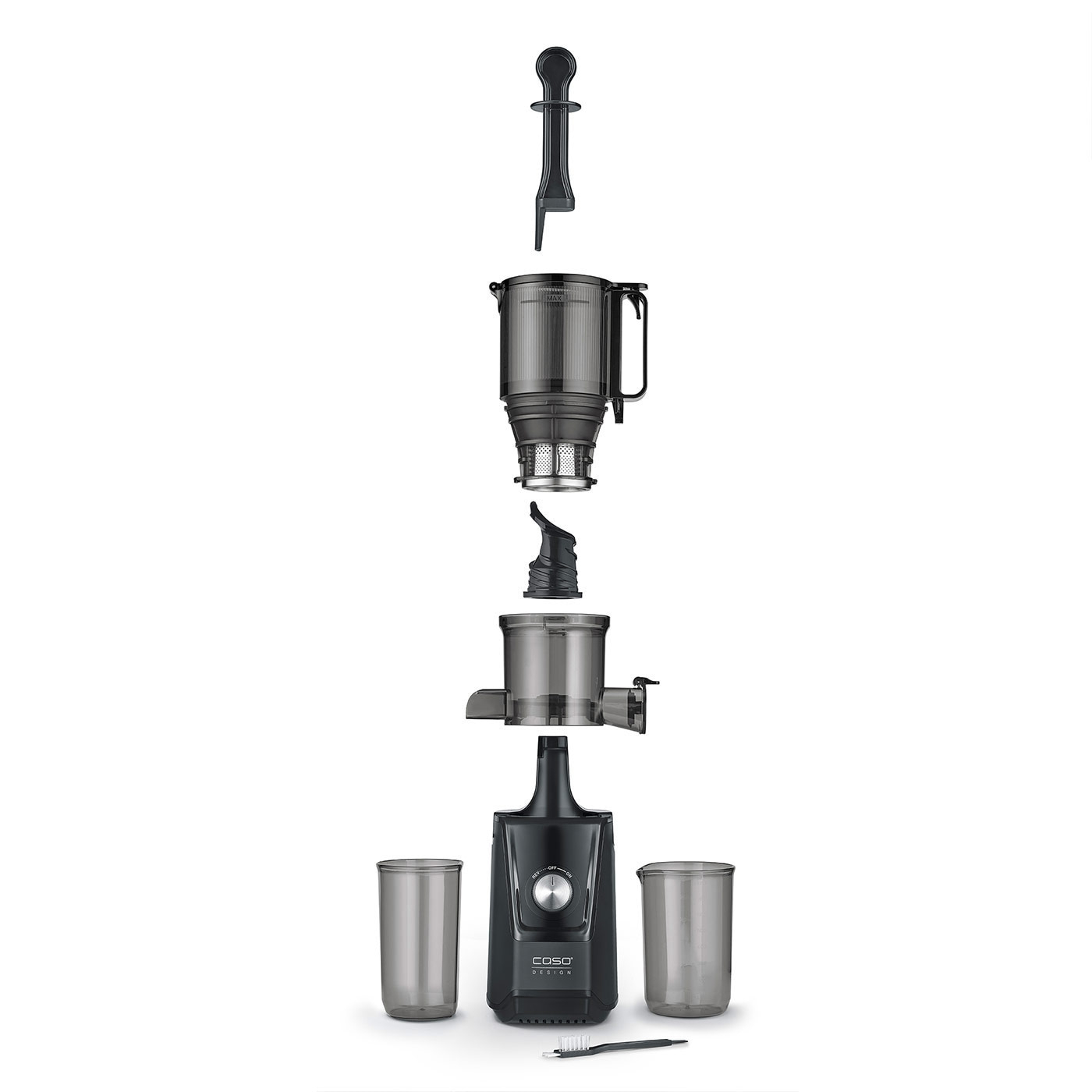 Disassembled juicer with accessories and glasses, ready for cleaning and assembly.