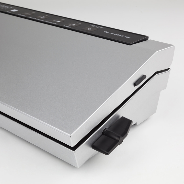 Silver vacuum sealer with black control panel and twist lock, GourmetVAC 200 appliance.