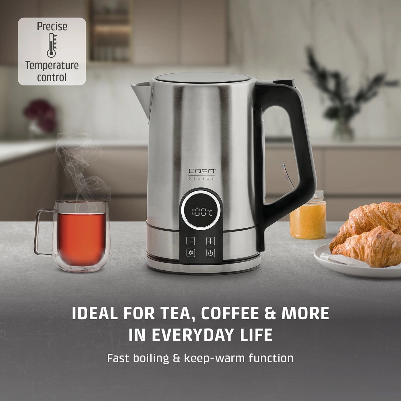 A kettle with temperature selection and a cup of tea.