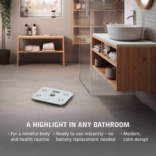 A white scale in a modern bathroom with wooden elements.