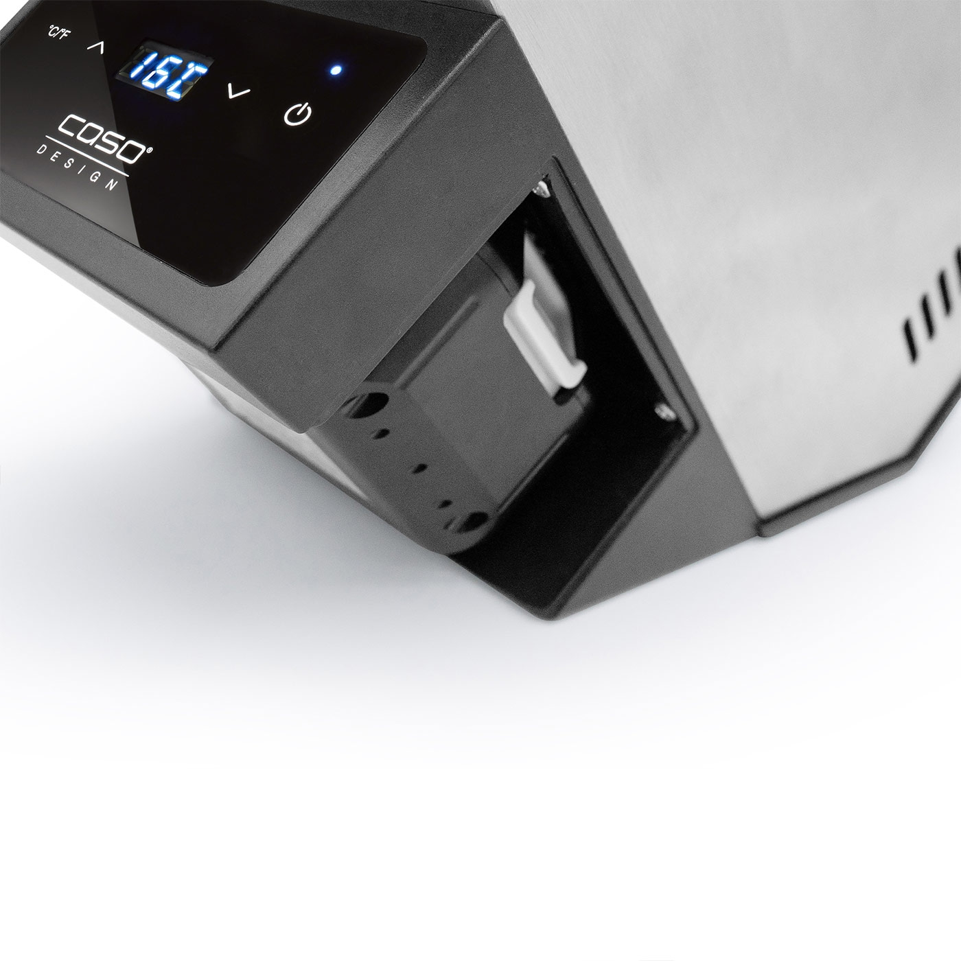 Close-up of a black device with digital display and temperature reading