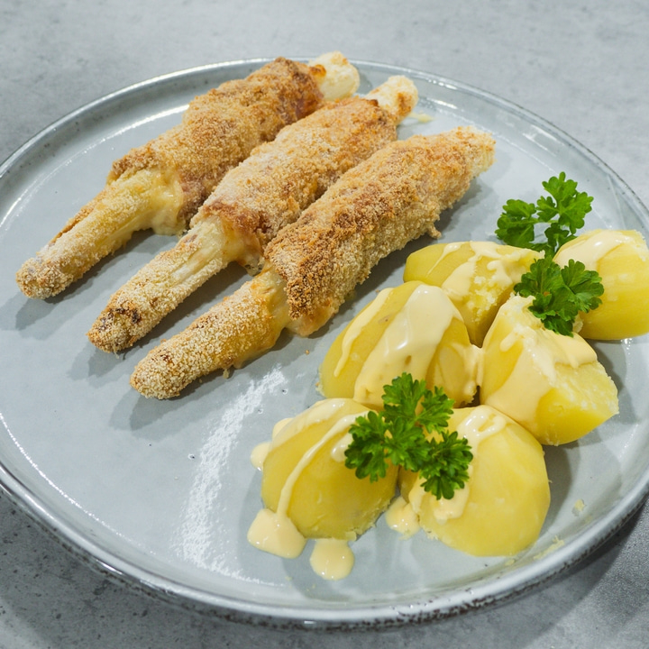 Fried food with potatoes and sauce on a plate, delicious meal