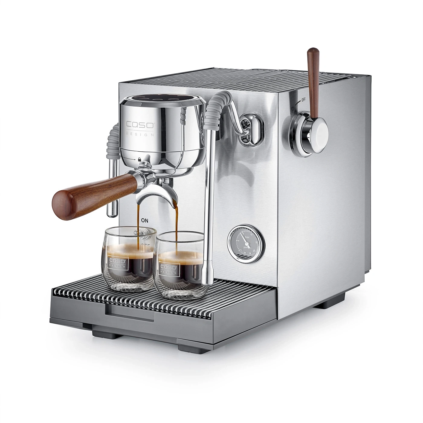 A silver espresso machine with wood accents brews two espressos into glass cups.