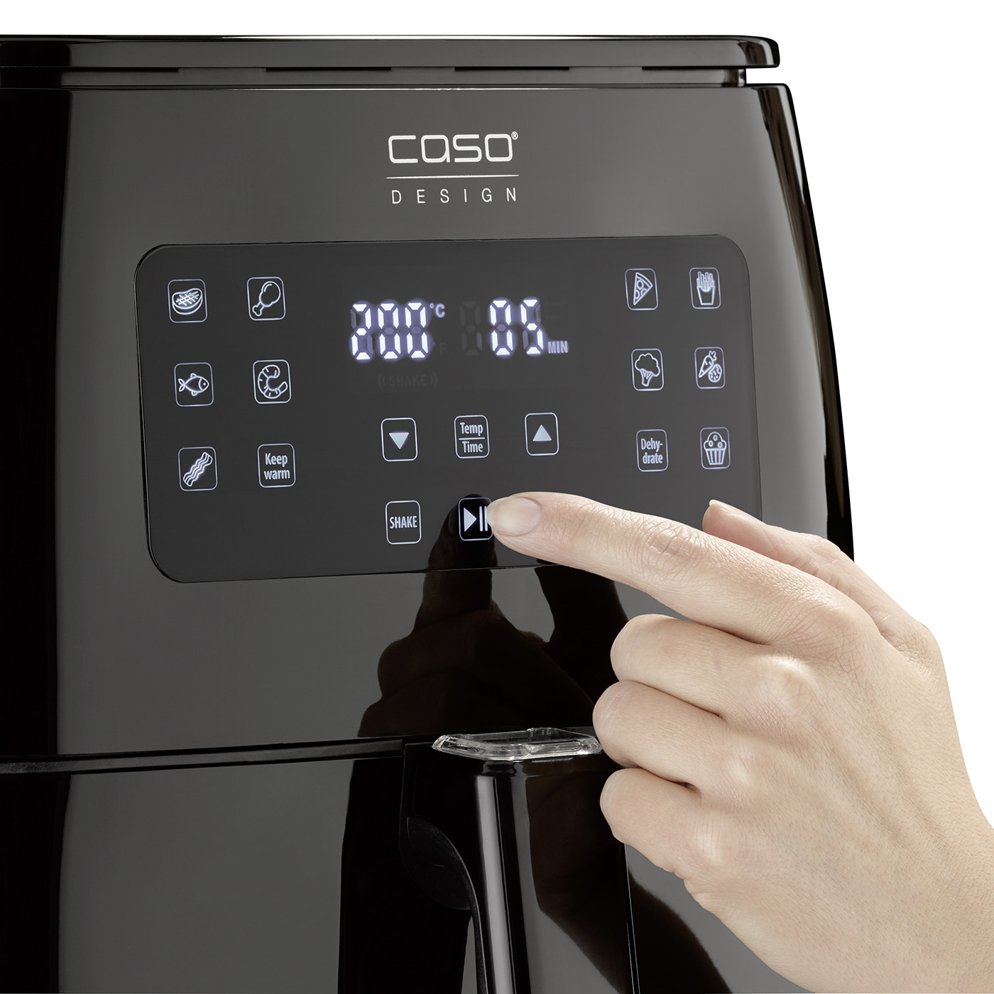 Air fryer with control panel, temperature and time, hand pressing start button.