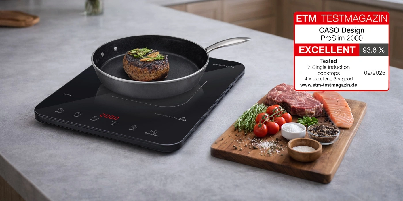 Induction hob with meat and fish on a wooden board