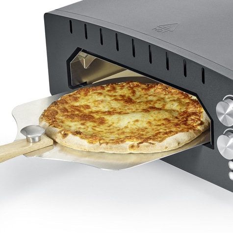Pizza in oven, on pizza peel, hot and delicious, cheese