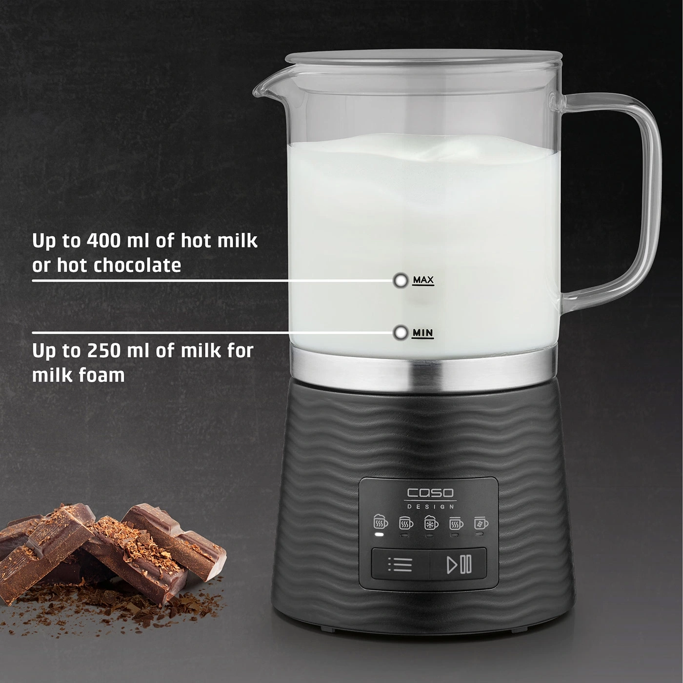 Milk frother with milk, chocolate and text. Hot milk and milk foam.