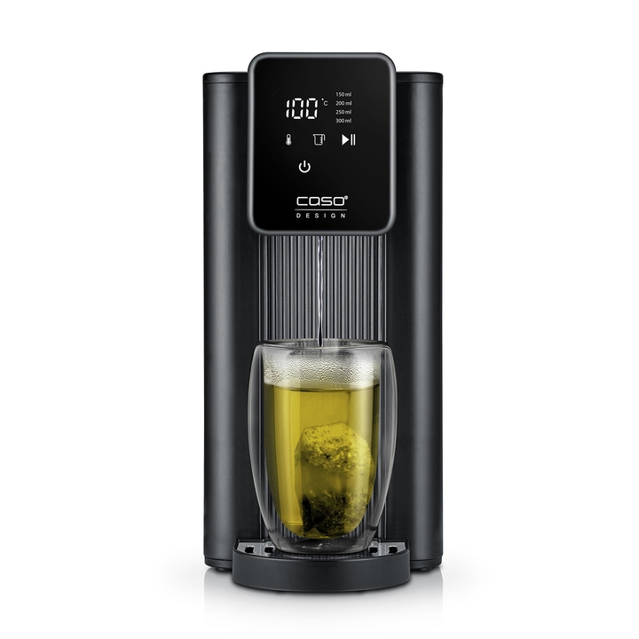 Black hot water dispenser with glass and tea bag, 100 degrees Celsius.