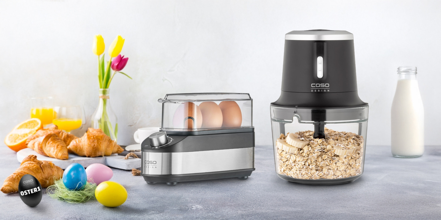 Easter breakfast with egg cooker, blender, croissants, orange juice, and milk.