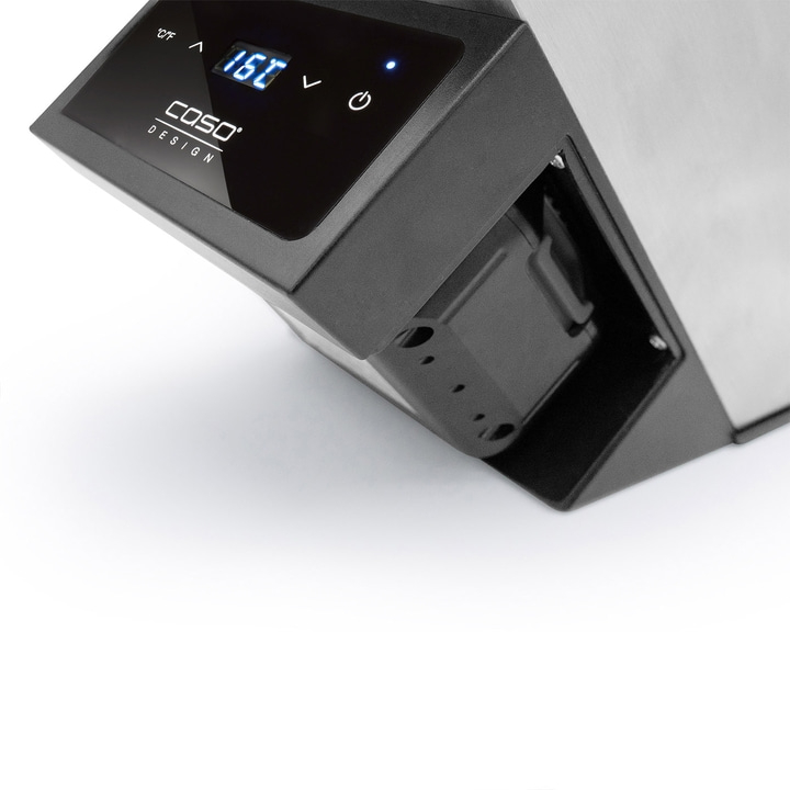 Close-up of a black device with digital display and temperature reading