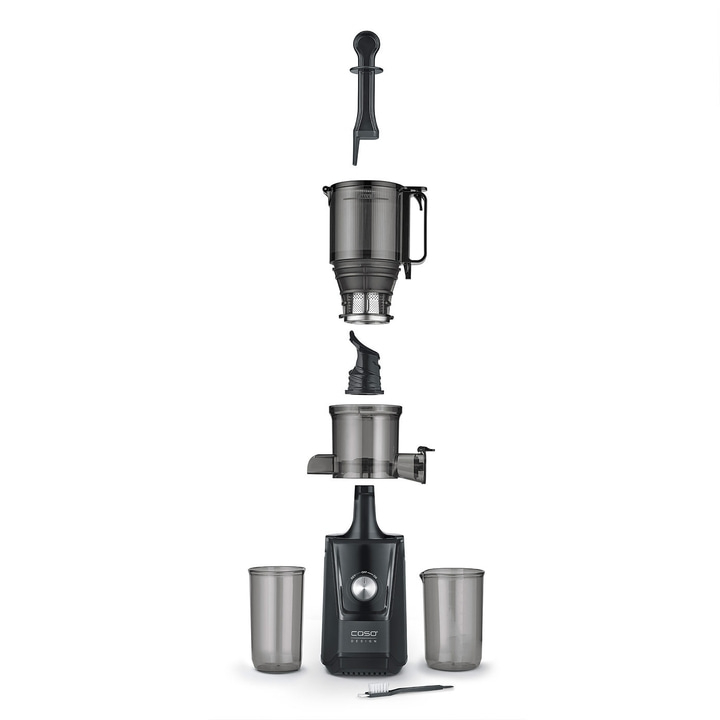 Disassembled juicer with accessories and glasses, ready for cleaning and assembly.