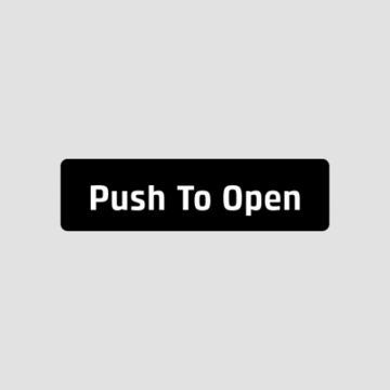 Ein schwarzer Knopf mit weißem Text "Push To Open".