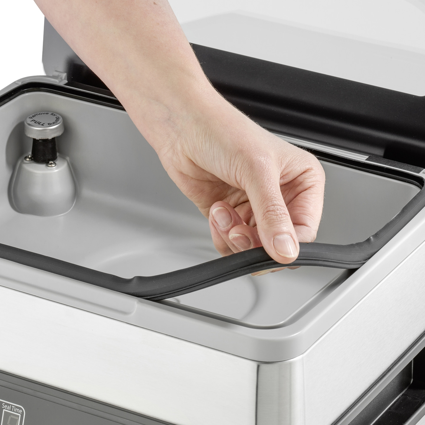 Hand opening vacuum sealer, rubber seal, gray container, detail shot, close-up