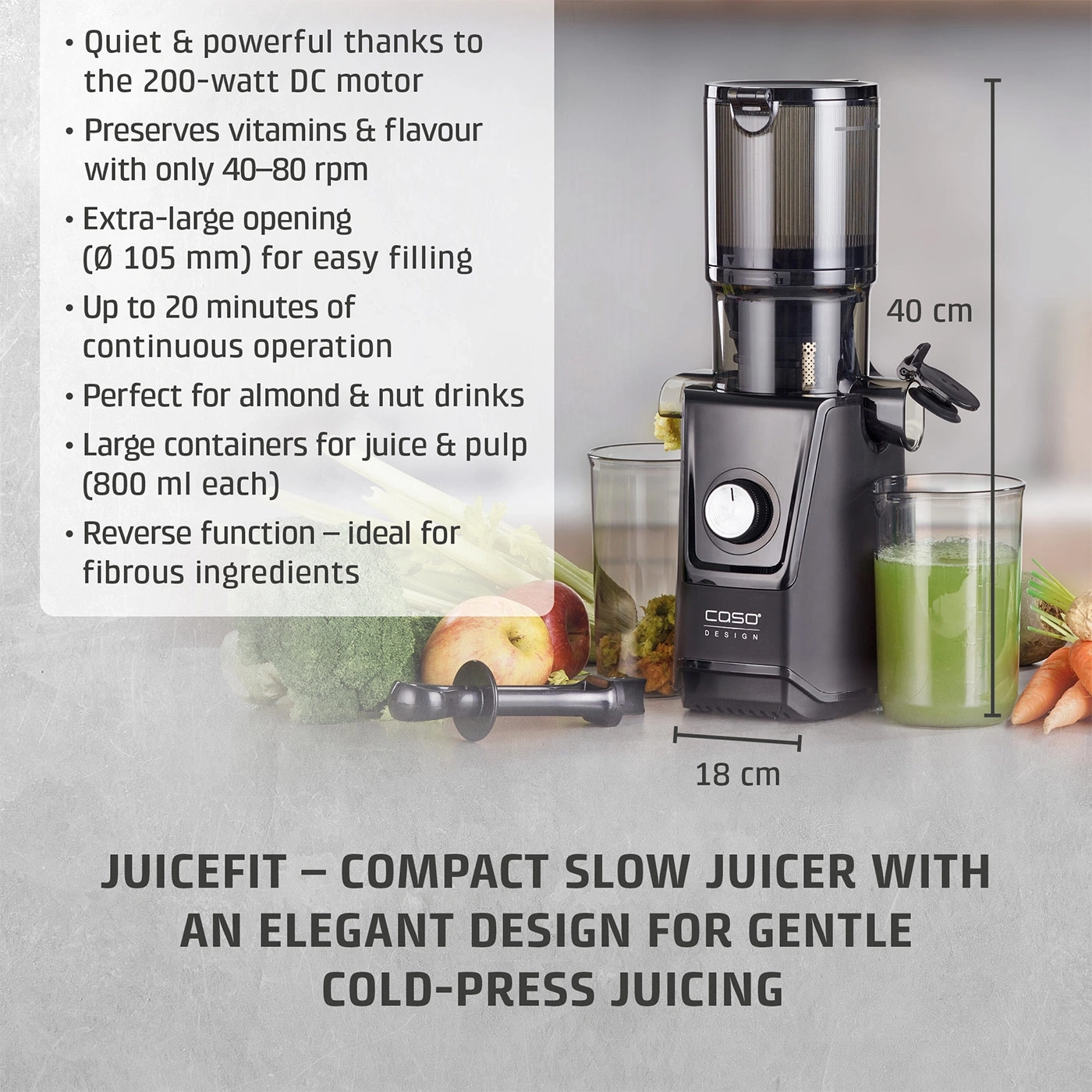 A black Caso slow juicer with juice and vegetables next to it.