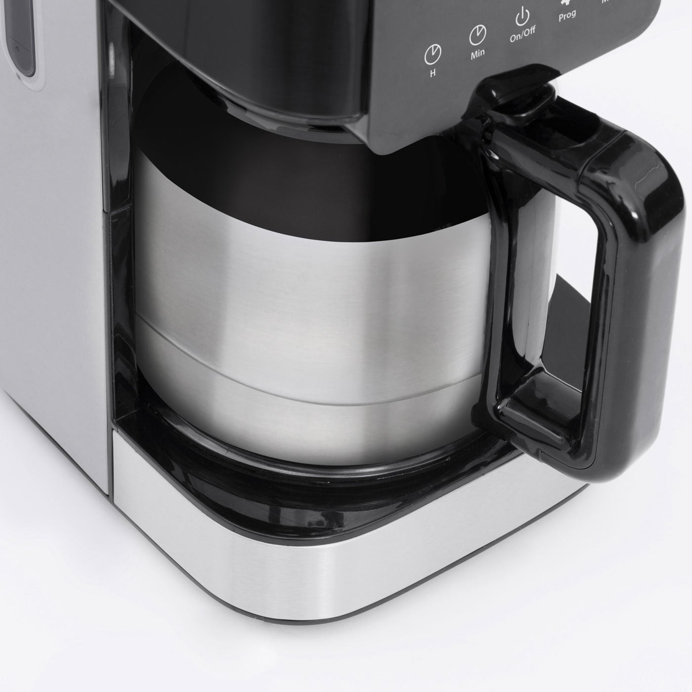 Close-up of a coffee maker with stainless steel and black elements, buttons, and handle.