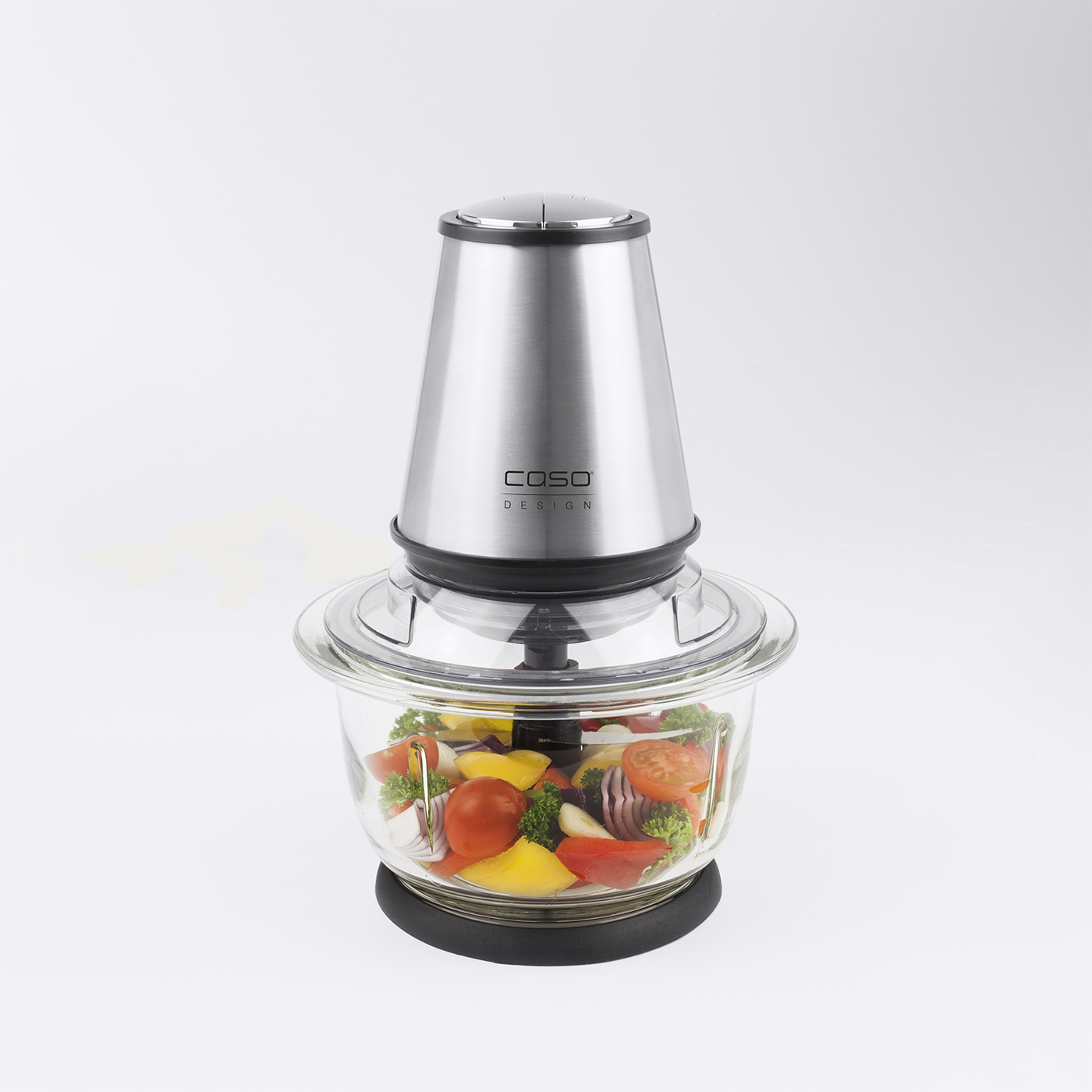 Food processor with vegetables in a glass container, isolated on white background