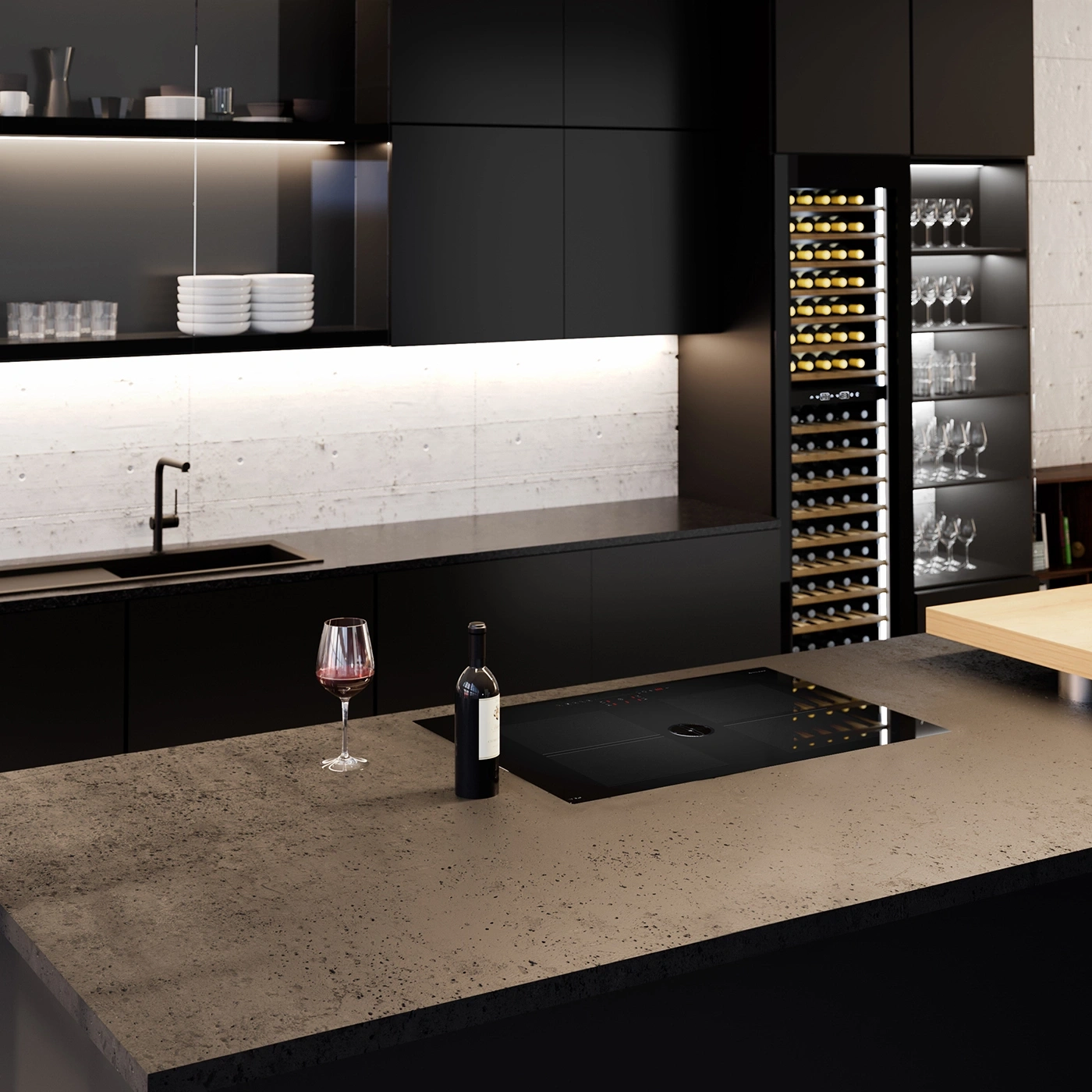 Modern black kitchen with wine rack, glasses, and a wine glass on the counter.