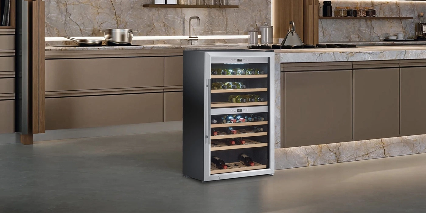 A modern wine cooler in a stylish kitchen with a marble countertop.