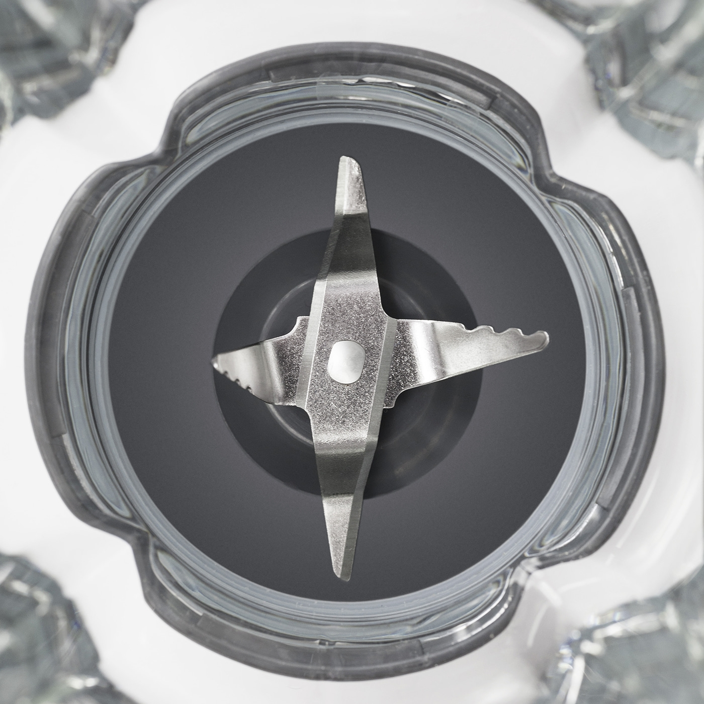 Close-up of a blender with blades and gray background. Detailed shot.