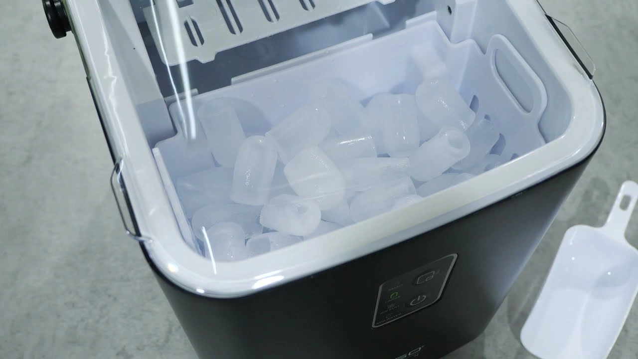 Ice machine with ice cubes, white container, black body, ice scoop, and power buttons.