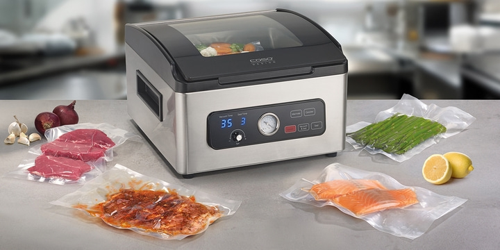 Vacuum sealer with food, vegetables, and meat packaged for preservation.
