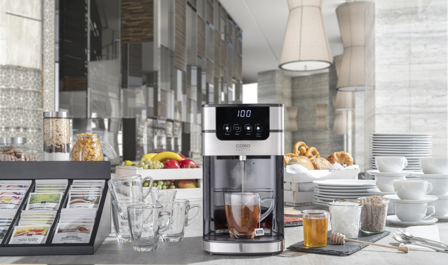 Tea machine with accessories, breakfast, cups, plates, honey, fruit, pastries