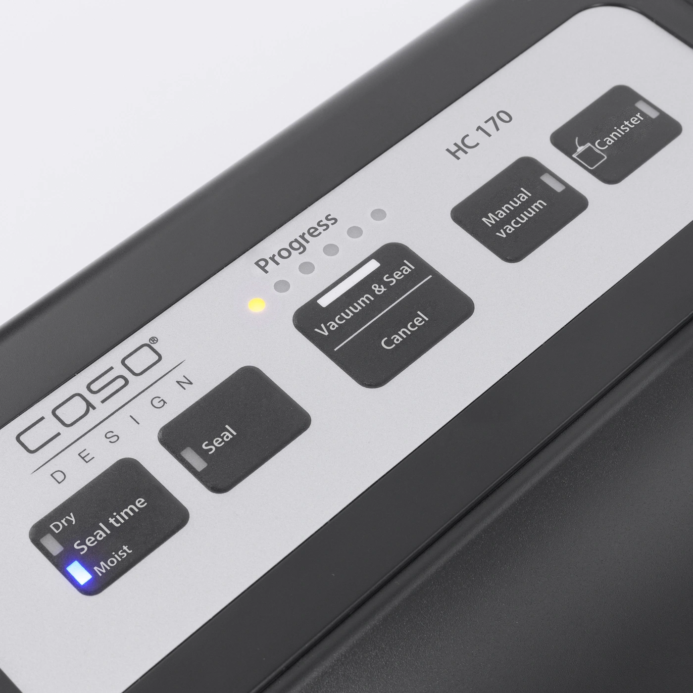 Vacuum sealer with buttons for various functions, including vacuum and seal, and canister.