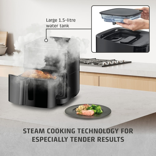 Steamer with large water tank and tender cooking results. Food on a plate.