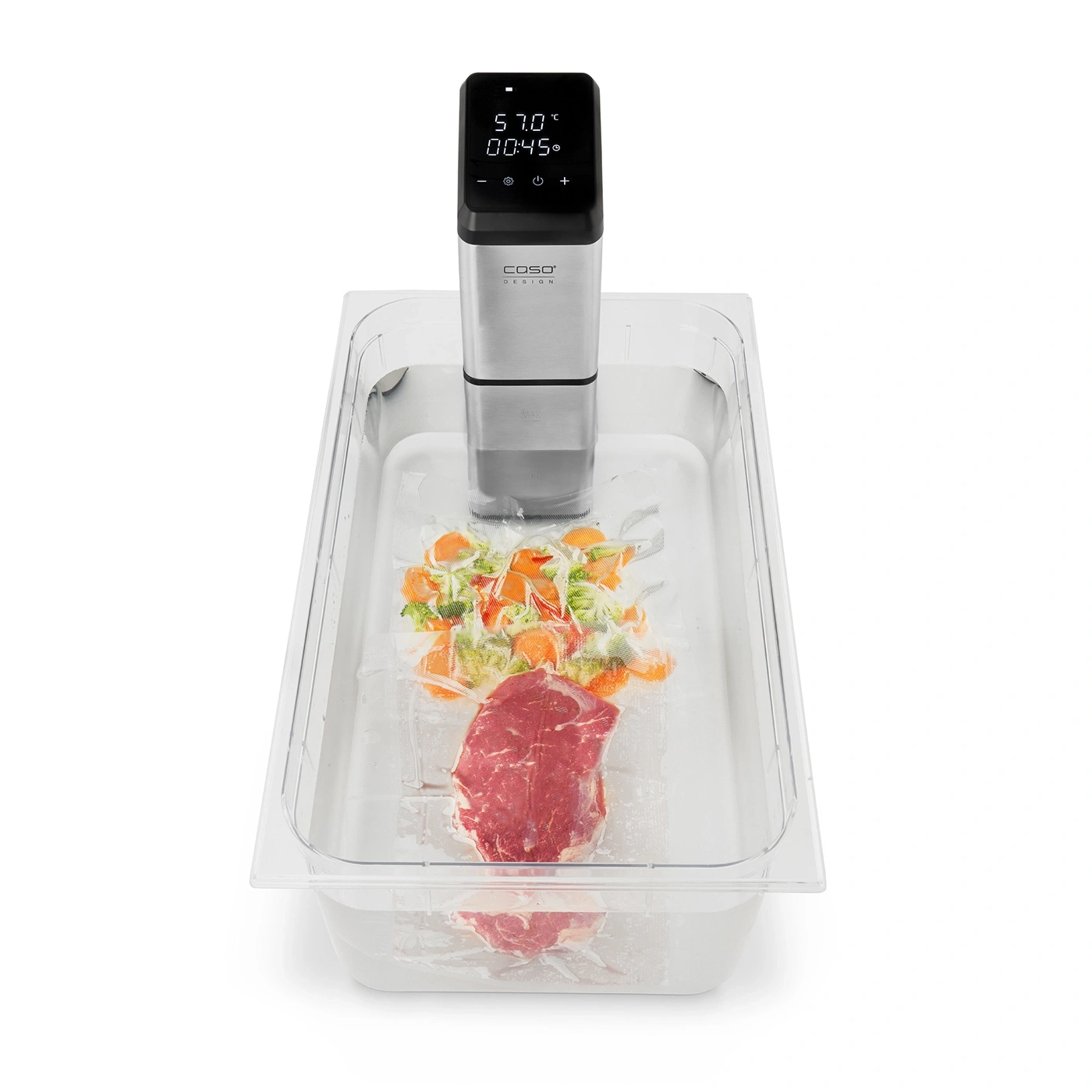 Sous vide machine with meat and vegetables in a water bath, ready for cooking.