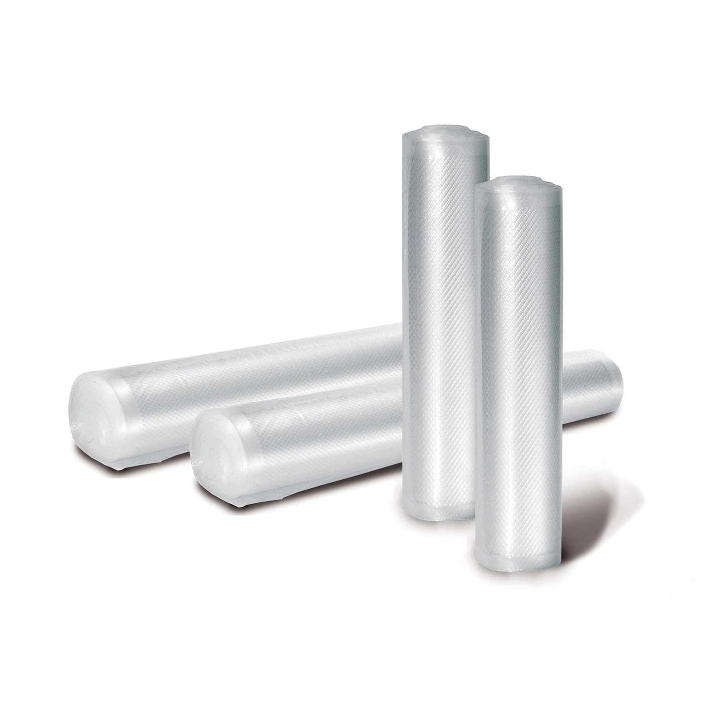 Rolls of transparent plastic lying on a white background, close up.