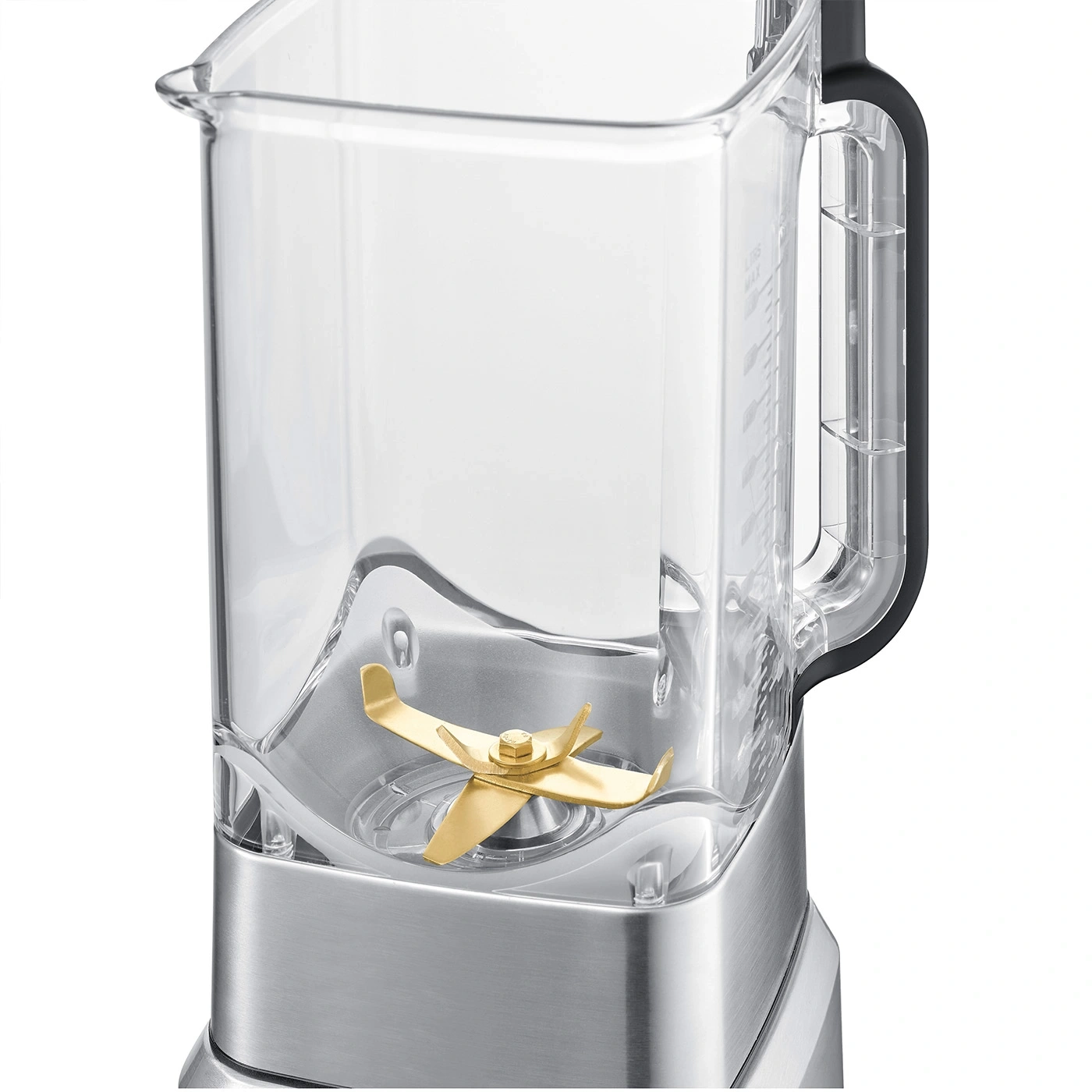 Close-up of an empty blender jar with golden blades.