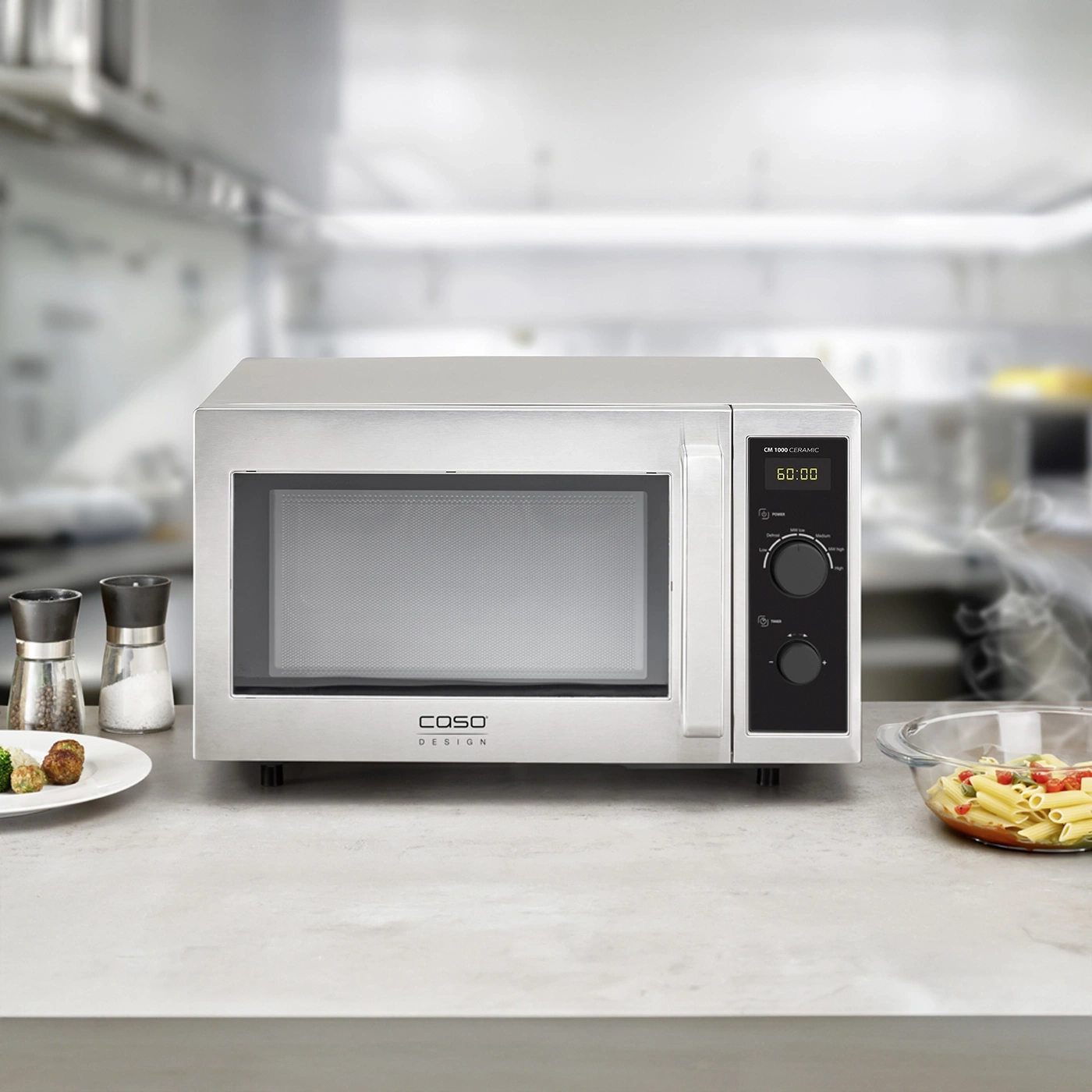 Microwave on a countertop with food and spices in the background