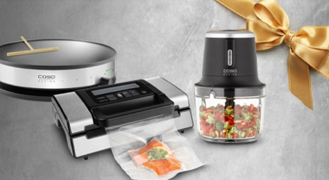 Kitchen appliances: vacuum sealer, mini chopper, and crepe maker on a gray background