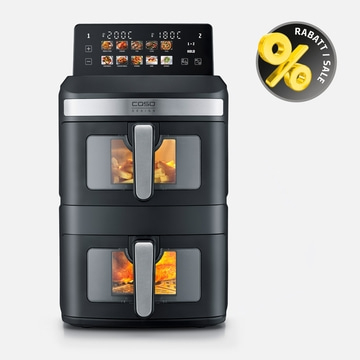 A black double air fryer with two drawers cooking food.