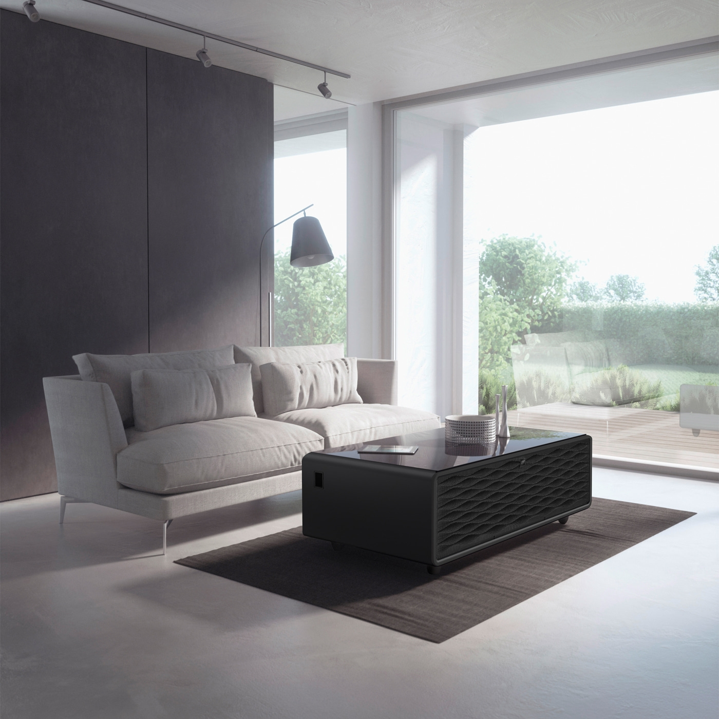 Modern living room with sofa, table, and window overlooking the green