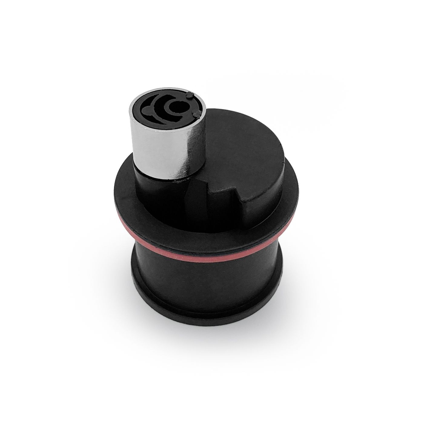 Schwarzes Kunststoffteil mit silbernem Zylinder und rotem Ring