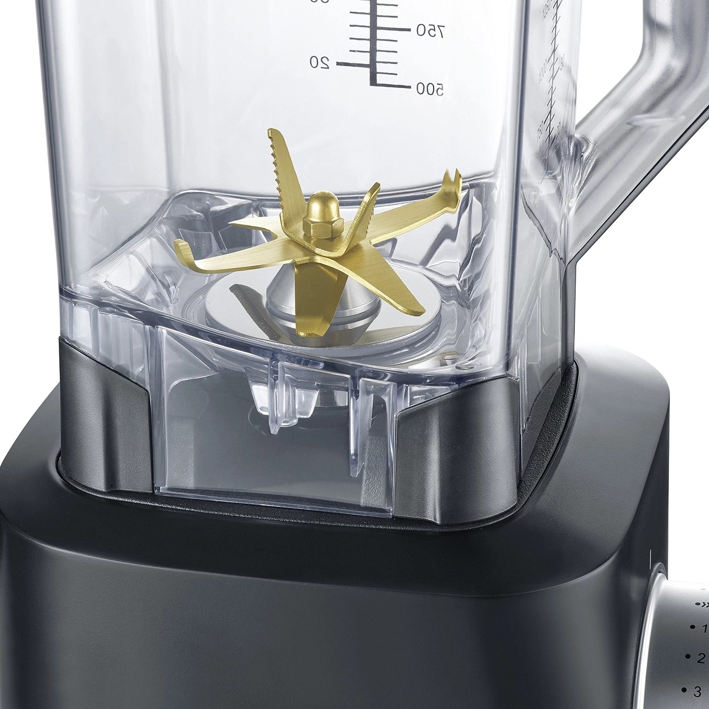 Close-up of a blender with golden blades and measurement scale