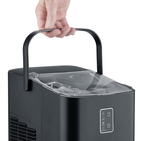 Black ice maker with handle being held by a hand, close-up shot.