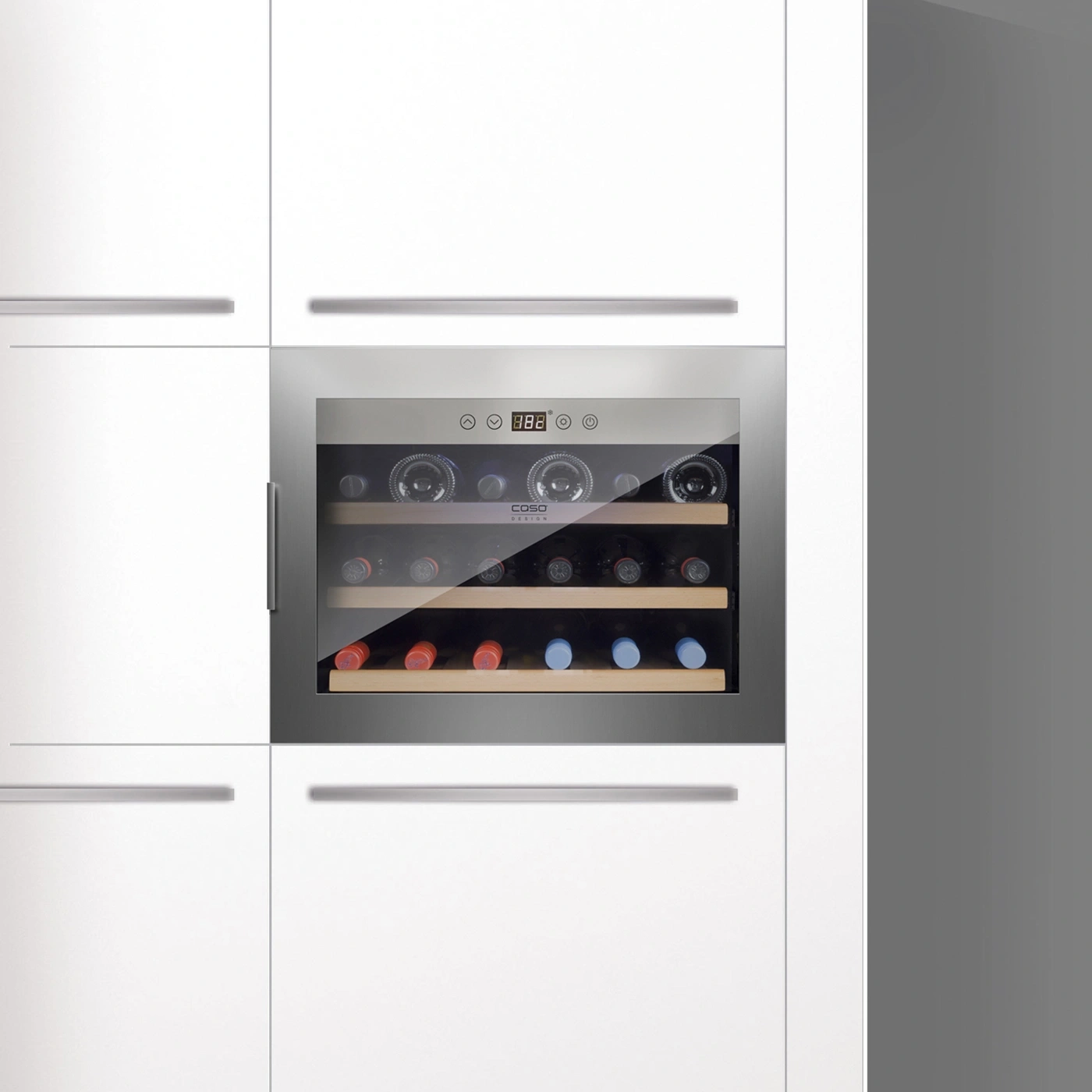 Wine cooler in white kitchen, built-in, with bottles and display