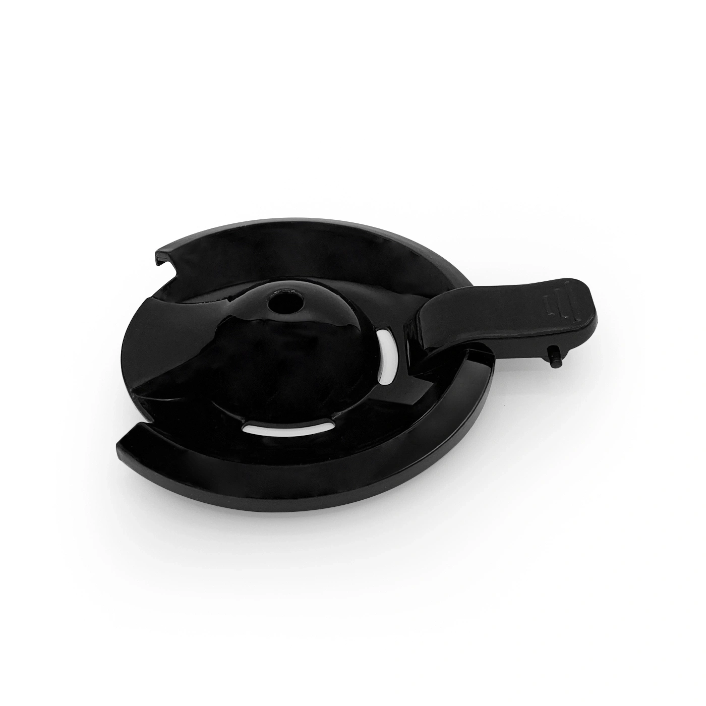 Black plastic part with round design and handle, isolated on white background.